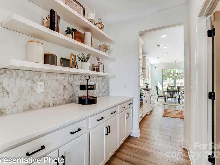 132 Longwood Road, Mooresville, NC 28115.  MLS# CAR4239532, YatesRealty ID 18934. Butler's Pantry will feature upper and lower cabinets for lots of additional storage