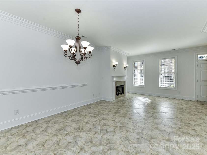 155 Harper Lee Street, Davidson, NC 28036.  MLS# CAR4328316, YatesRealty ID 18953. Beautiful chair railing and deep crown molding