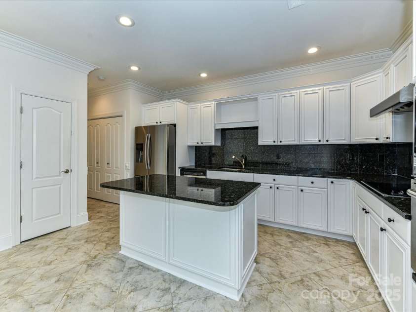 155 Harper Lee Street, Davidson, NC 28036.  MLS# CAR4328316, YatesRealty ID 18953. Large island with extra bar seating and storage