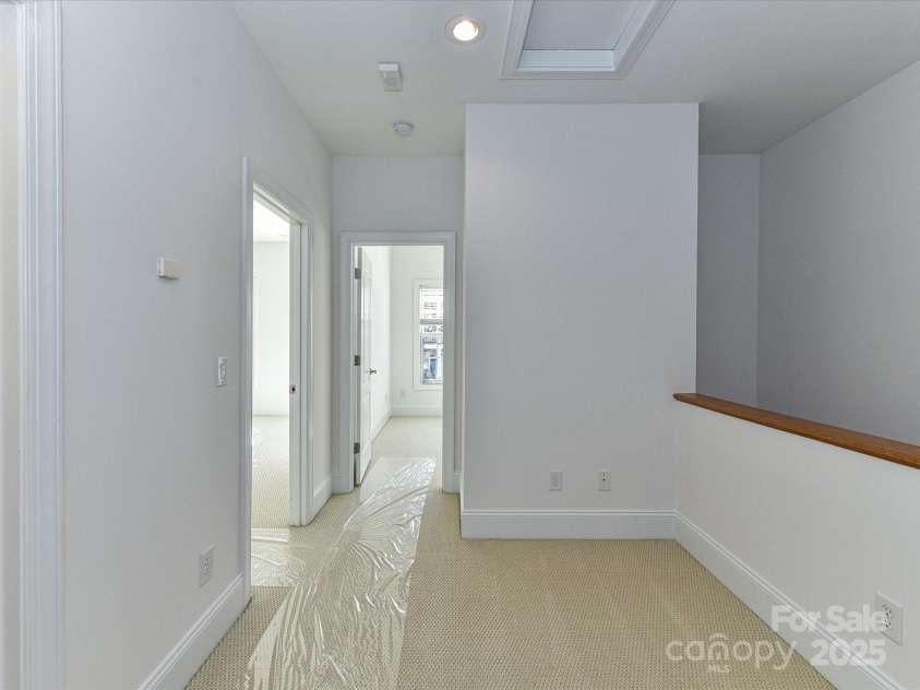 155 Harper Lee Street, Davidson, NC 28036.  MLS# CAR4328316, YatesRealty ID 18953. Loft on the second level is perfect for a small office or reading nook