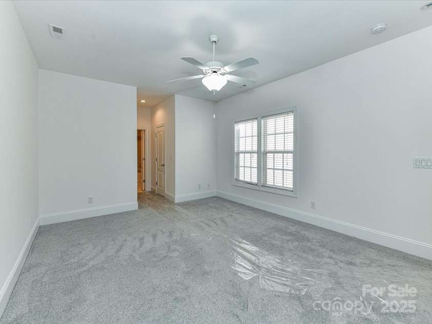 155 Harper Lee Street, Davidson, NC 28036.  MLS# CAR4328316, YatesRealty ID 18953. Primary Bedroom on the main level with en-suite bathroom