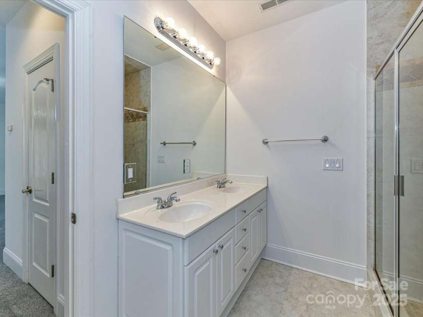 155 Harper Lee Street, Davidson, NC 28036.  MLS# CAR4328316, YatesRealty ID 18953. Two sinks in the Primary Bathroom