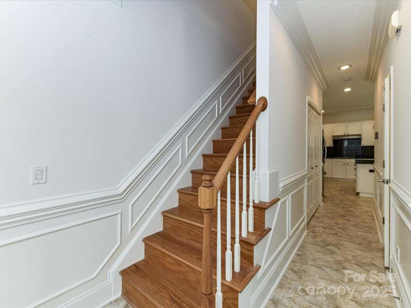 155 Harper Lee Street, Davidson, NC 28036.  MLS# CAR4328316, YatesRealty ID 18953. Wood staircase leading to the second level