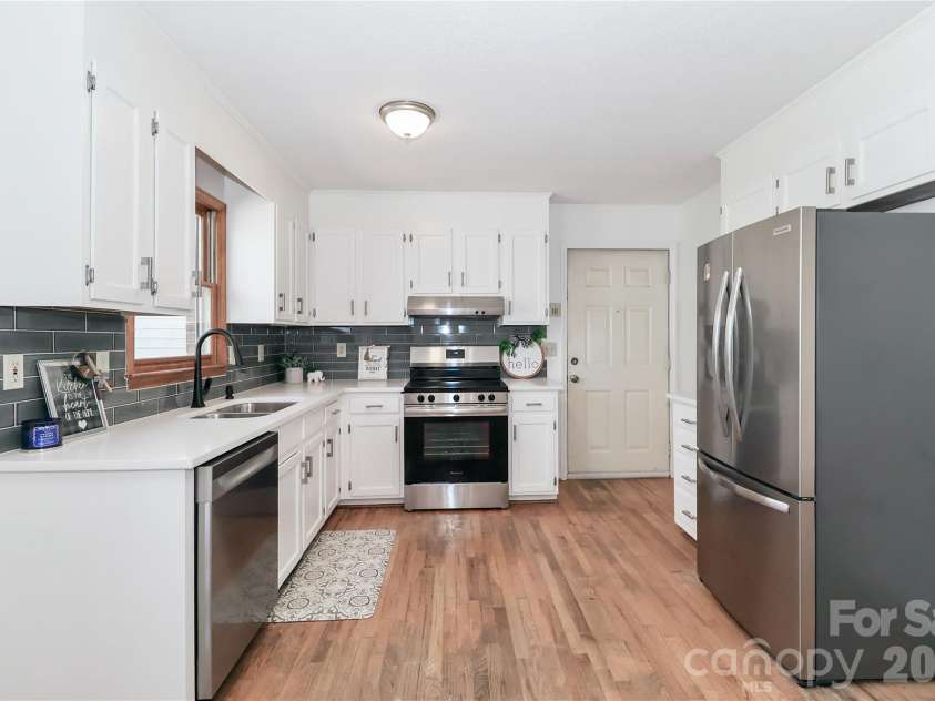 753 Stoney Lane, Statesville, NC 28625.  MLS# CAR4358635, YatesRealty ID 18956. Kitchen with side entry door