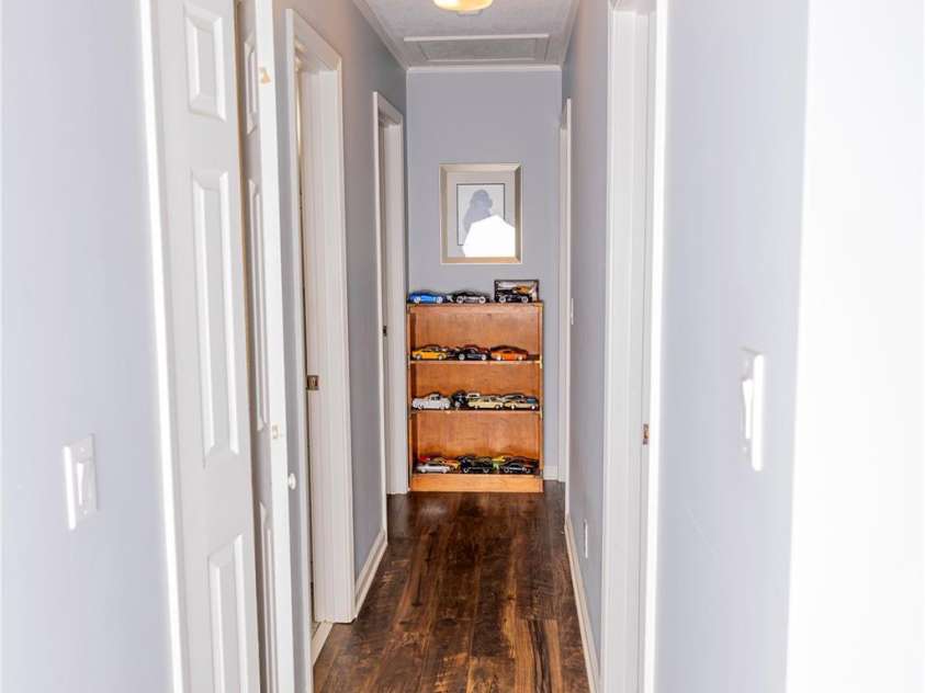 57 Gribble Road, Franklin, NC 28734.  MLS# CAR4253647, YatesRealty ID 18958. Hallway from Living Room to Bedrooms and Bathrooms