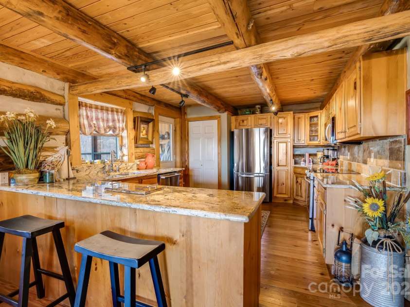 1873 El Miner Drive, Mars Hill, NC 28754.  MLS# CAR4251869, YatesRealty ID 18968. A warm, welcoming kitchen ready for home-cooked meals and memories.