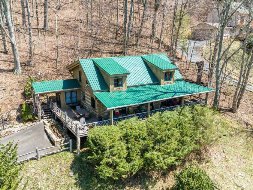1873 El Miner Drive, Mars Hill, NC 28754.  MLS# CAR4251869, YatesRealty ID 18968. Beautiful rock wall and mature landscaping.