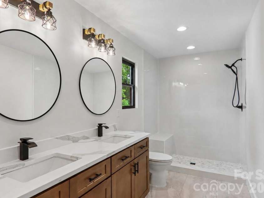 124 Main Street, Mars Hill, NC 28754.  MLS# CAR4375726, YatesRealty ID 18973. Primary bathroom with double vanities.