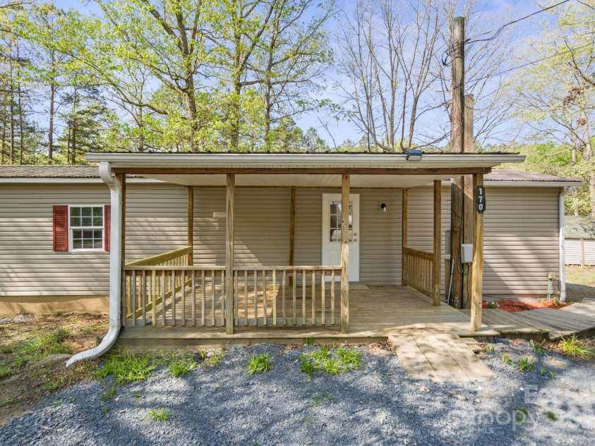 170 Dusty Loop Drive, Mount Gilead, NC 27306.  MLS# CAR4244157, YatesRealty ID 18973. Large Cover Front Porch