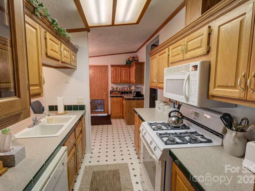 8020 Meadow Fork Road, Hot Springs, NC 28743.  MLS# CAR4306581, YatesRealty ID 1898. Guest House kitchen