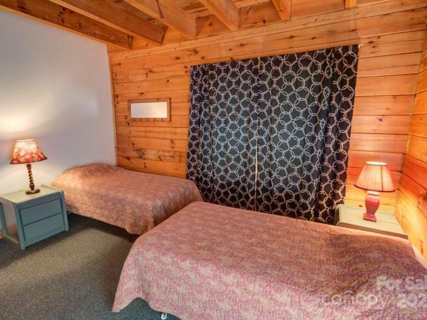 8020 Meadow Fork Road, Hot Springs, NC 28743.  MLS# CAR4306581, YatesRealty ID 1898. Main Lodge lower another lower level bedroom