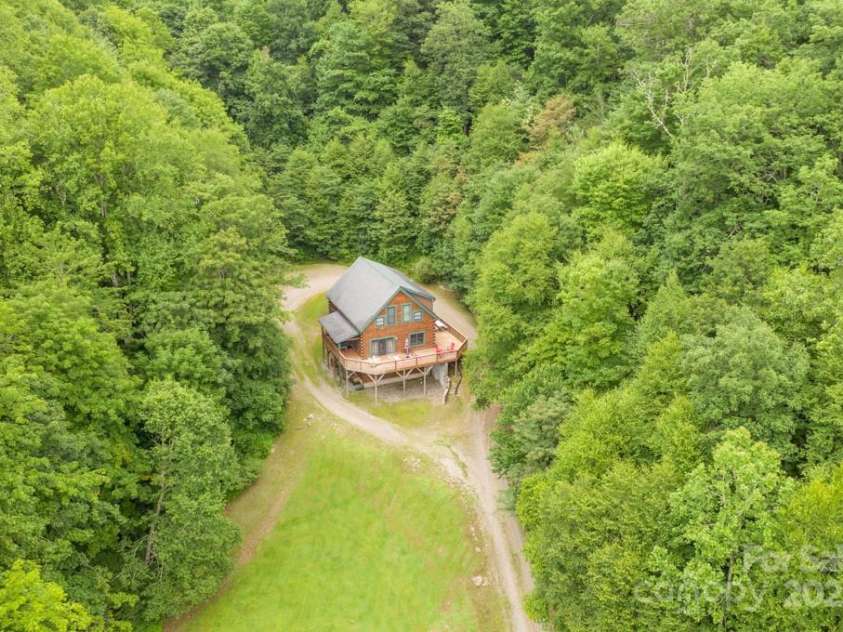 8020 Meadow Fork Road, Hot Springs, NC 28743.  MLS# CAR4306581, YatesRealty ID 1898. Main lodge overlooking the pasture