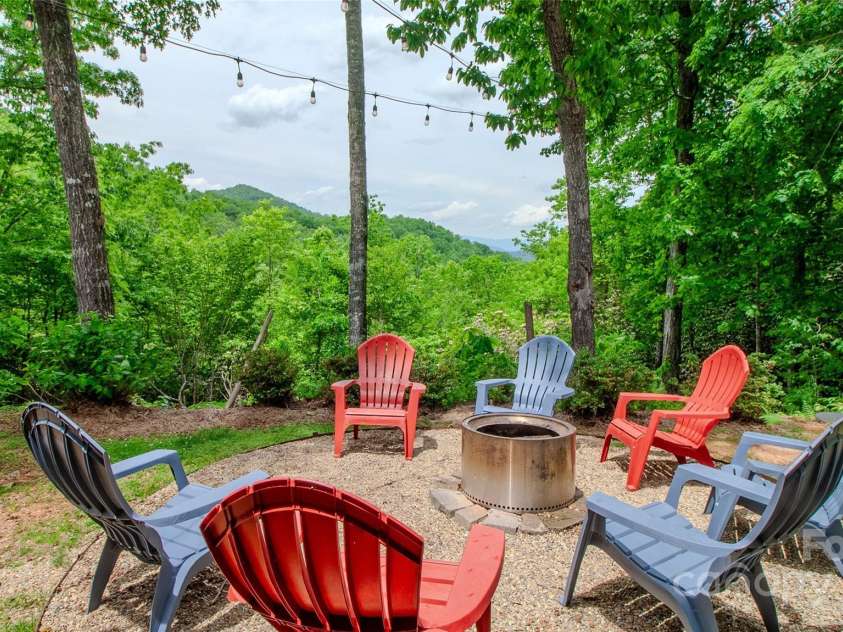 187 Gardeners Cove Road, Whittier, NC 28789.  MLS# CAR4231313, YatesRealty ID 18982. Firepit area