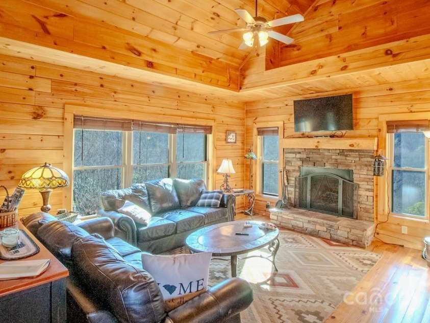 187 Gardeners Cove Road, Whittier, NC 28789.  MLS# CAR4231313, YatesRealty ID 18982. Great Room with rock Fireplace