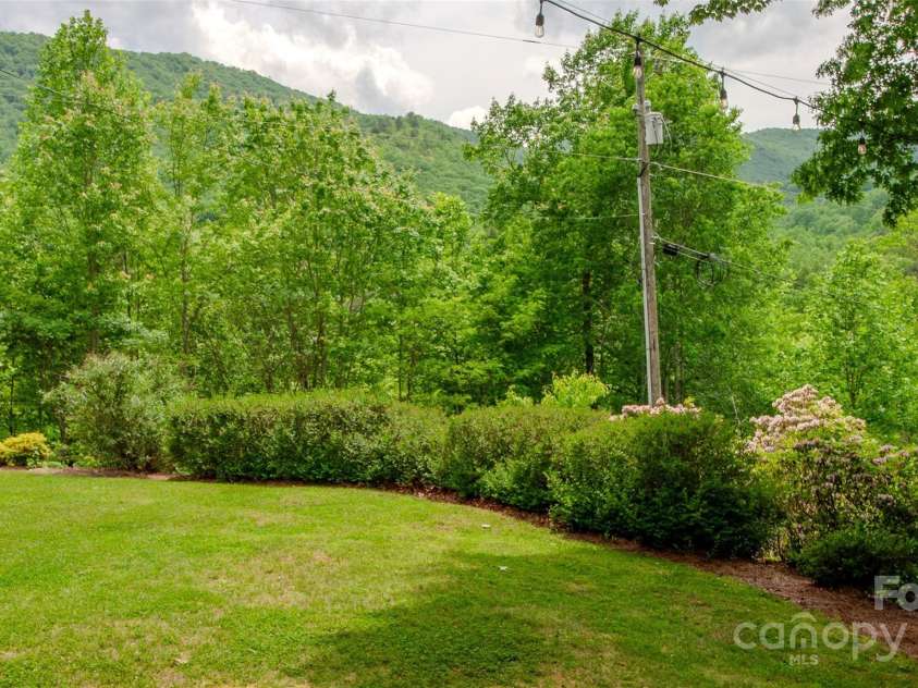 187 Gardeners Cove Road, Whittier, NC 28789.  MLS# CAR4231313, YatesRealty ID 18982. Level side yard
