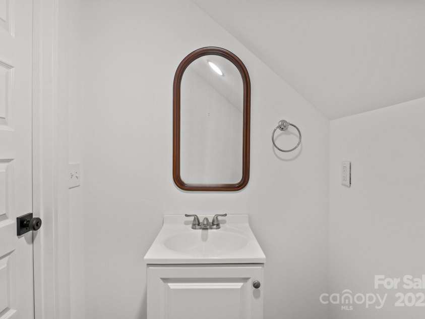 213 Genesis Place, Cleveland, NC 27013.  MLS# CAR4262619, YatesRealty ID 18984. Half bathroom off of the bonus room