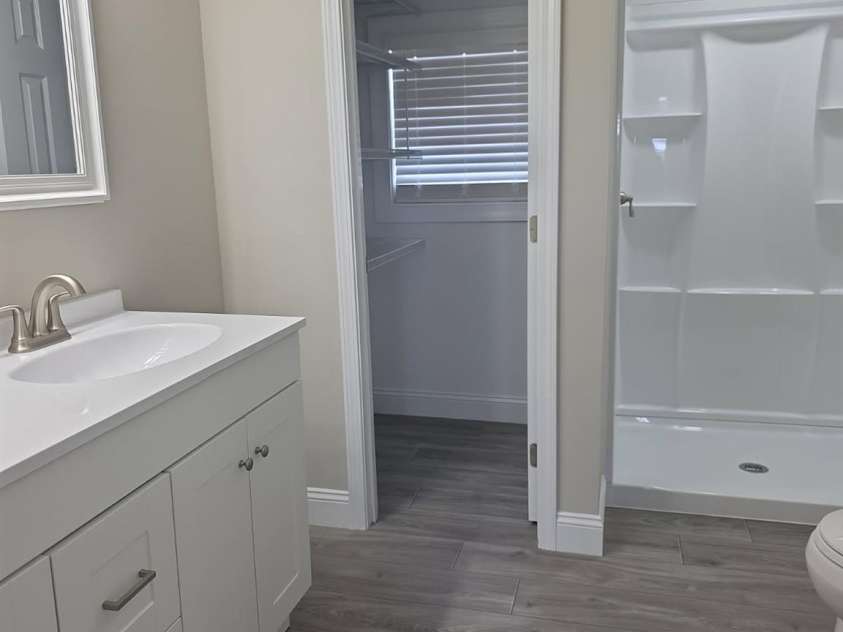 6006 White Store Road, Marshville, NC 28103.  MLS# CAR4256474, YatesRealty ID 18986. Bathroom adjacent to primary bedroom