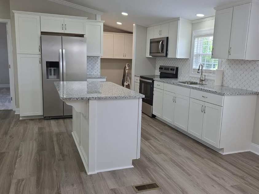 6006 White Store Road, Marshville, NC 28103.  MLS# CAR4256474, YatesRealty ID 18986. Kitchen looking from dining area
