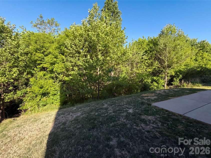 1303 Farm Branch Drive, Concord, NC 28027.  MLS# CAR4402107, YatesRealty ID 18987. Back yard