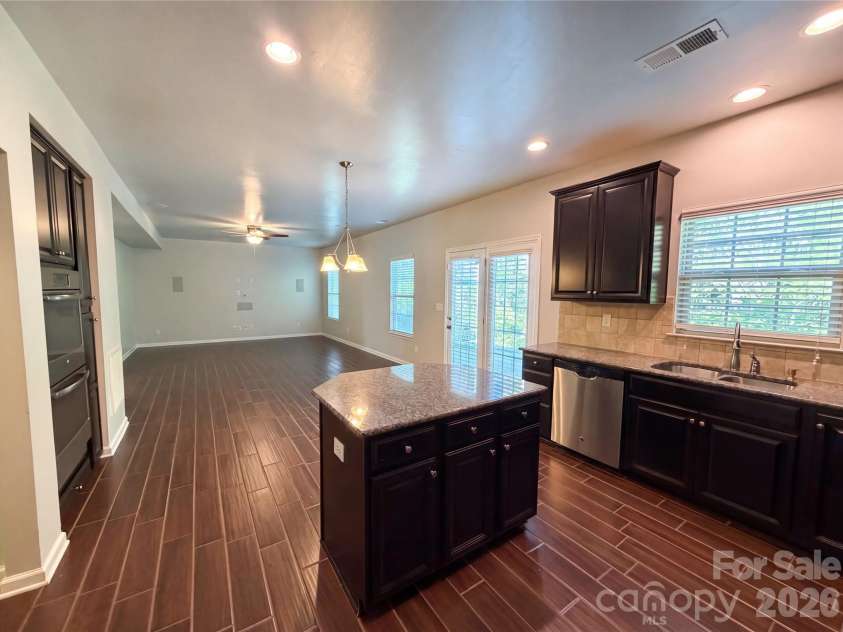 1303 Farm Branch Drive, Concord, NC 28027.  MLS# CAR4402107, YatesRealty ID 18987. Kitchen/living room