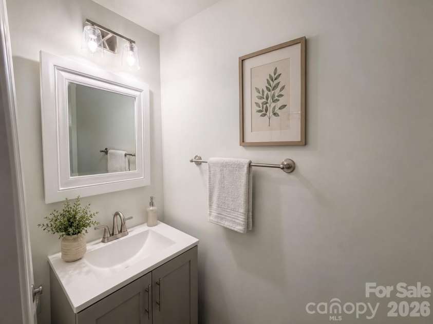 1303 Farm Branch Drive, Concord, NC 28027.  MLS# CAR4402107, YatesRealty ID 18987. Powder room virtually staged