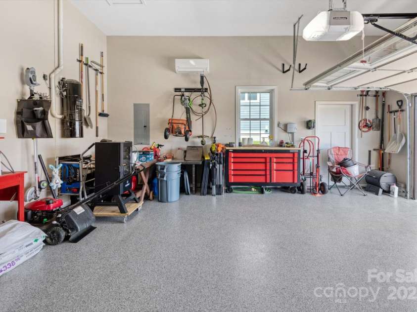 423 Blacksmith Run Drive, Hendersonville, NC 28792.  MLS# CAR4245571, YatesRealty ID 18989. Attached 2 car garage with finished epoxy floor and HVAC!