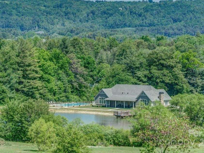 423 Blacksmith Run Drive, Hendersonville, NC 28792.  MLS# CAR4245571, YatesRealty ID 18989. Clubhouse with mountain backdrop.