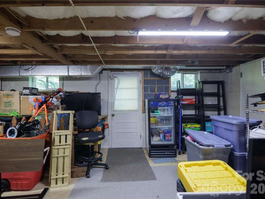 137 Whisperwood Circle, Hendersonville, NC 28791.  MLS# CAR4376933, YatesRealty ID 19002. Workshop  downstairs