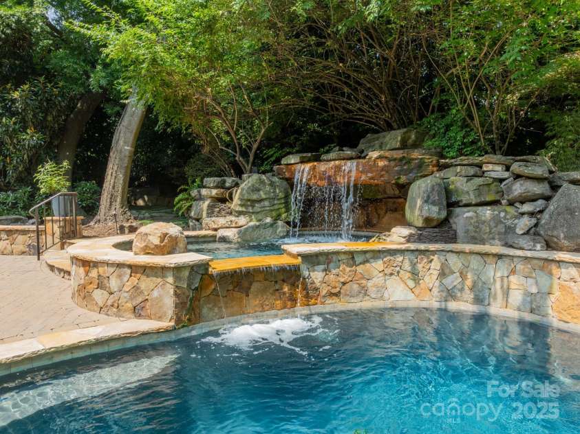 4001 Doves Roost Court, Charlotte, NC 28211.  MLS# CAR4266403, YatesRealty ID 19006. Spa & Waterfall