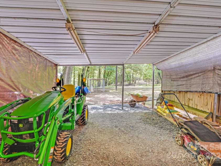 211 Drive Inn Road, Locust, NC 28097.  MLS# CAR4265447, YatesRealty ID 19009. Tractor Shed/Covered Equipment Parking about 16'2