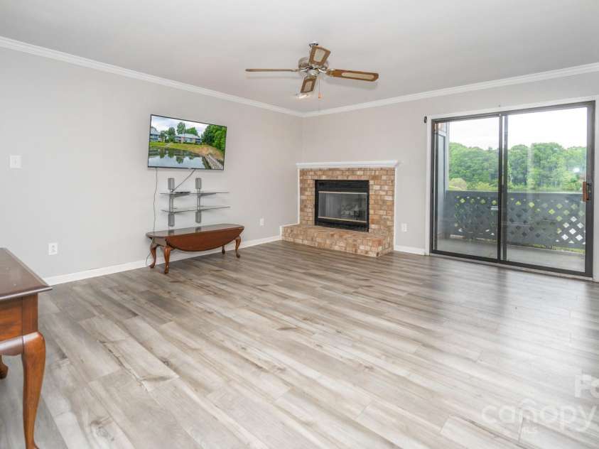 5833 Harris Grove Lane, Charlotte, NC 28212.  MLS# CAR4254761, YatesRealty ID 19011. Family room w sliders to back porch