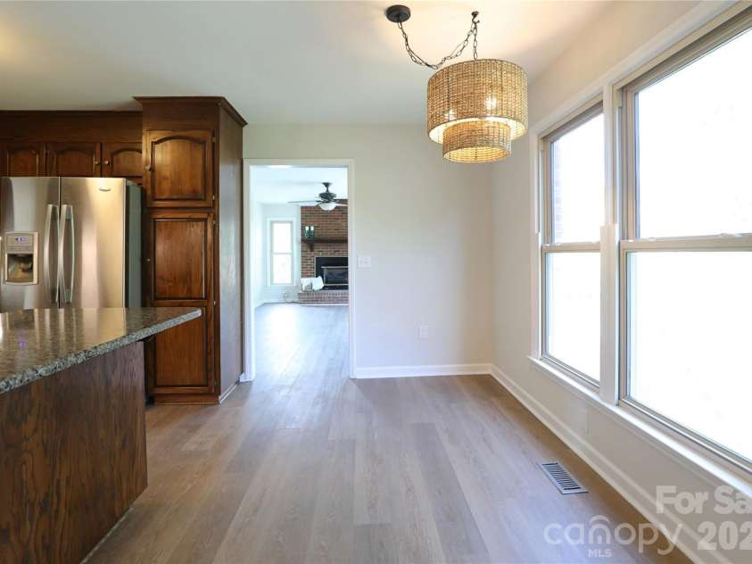 12809 Pine Bluff Road, Midland, NC 28107.  MLS# CAR4374117, YatesRealty ID 19012. Breakfast area offers double windows for ample natural light and connects to den.