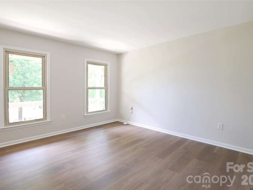 12809 Pine Bluff Road, Midland, NC 28107.  MLS# CAR4374117, YatesRealty ID 19012. Front living room can easily offer office on main level.