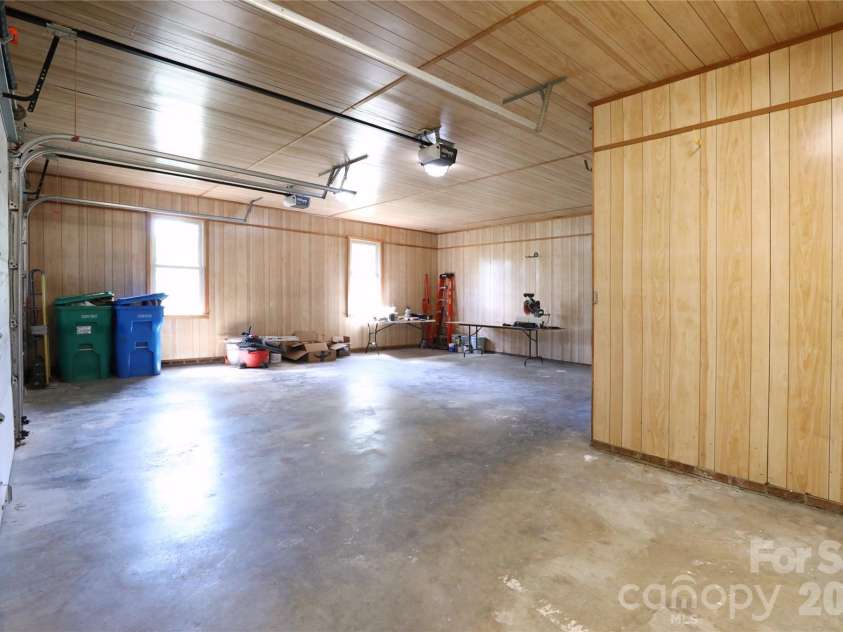 12809 Pine Bluff Road, Midland, NC 28107.  MLS# CAR4374117, YatesRealty ID 19012. Huge 2 car garage with additional workshop space.