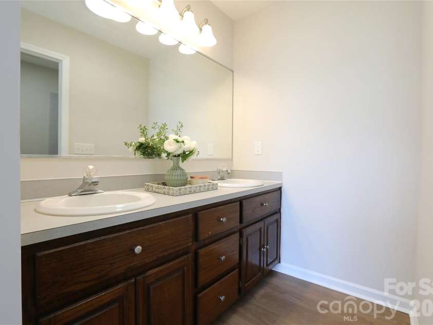 12809 Pine Bluff Road, Midland, NC 28107.  MLS# CAR4374117, YatesRealty ID 19012. Primary bathroom offers double vanity.