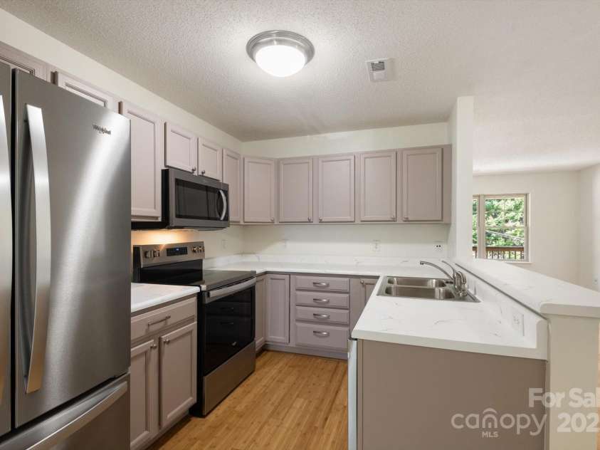 252 Unit F Wash Creek Drive, Hendersonville, NC 28739.  MLS# CAR4243596, YatesRealty ID 19031. 