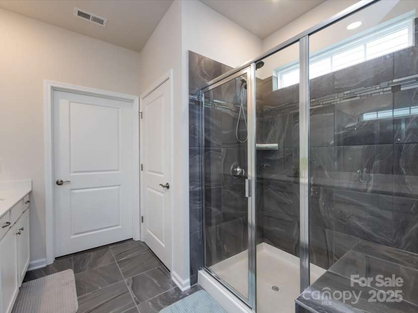 3199 Windhaven Lane, Tega Cay, SC 29708.  MLS# CAR4250667, YatesRealty ID 19032. Shower with Bench