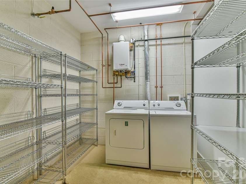 52 Mandolin Drive, Black Mountain, NC 28711.  MLS# CAR4377547, YatesRealty ID 19033. Laundry Area and Tankless Water Heater Plus Super Storage