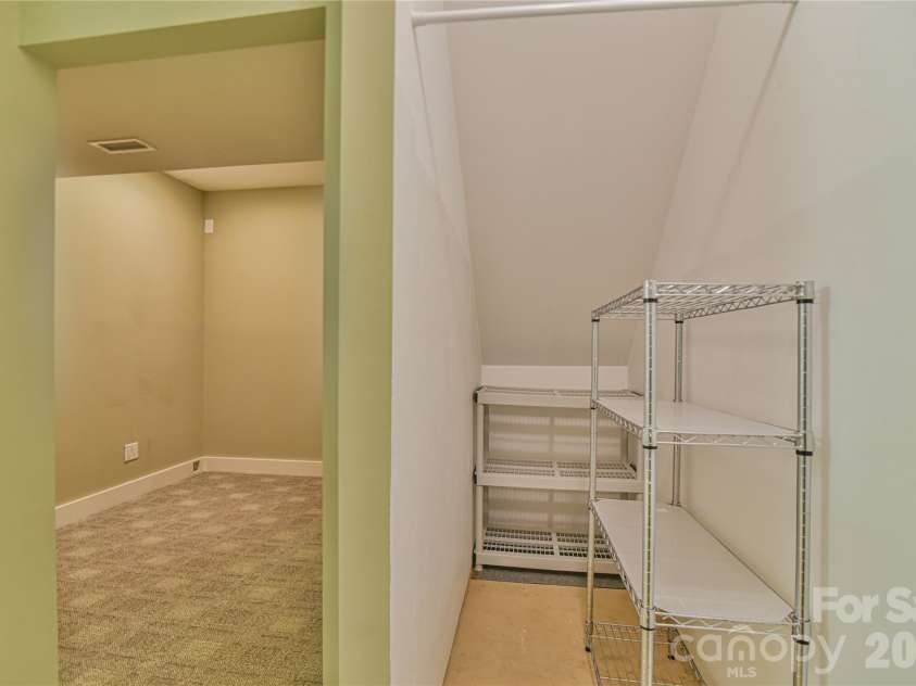 52 Mandolin Drive, Black Mountain, NC 28711.  MLS# CAR4377547, YatesRealty ID 19033. Storage Area Under the Stairs