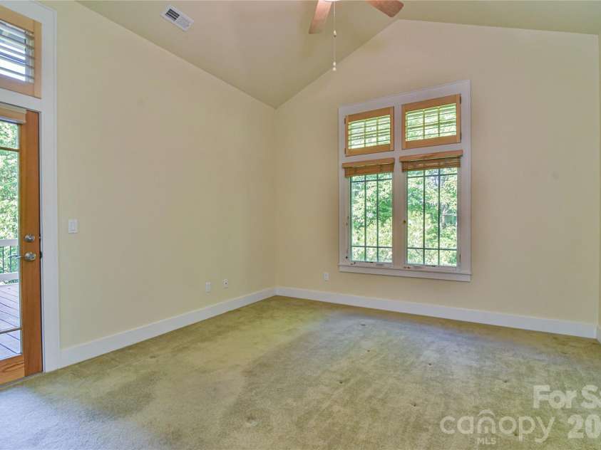 52 Mandolin Drive, Black Mountain, NC 28711.  MLS# CAR4377547, YatesRealty ID 19033. View of Primary Bedroom with Vaulted Ceiling
