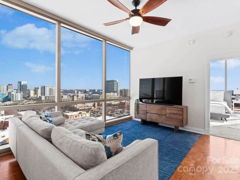 315 Arlington Avenue, Charlotte, NC 28203.  MLS# CAR4334361, YatesRealty ID 1904. Floor to ceiling windows in the living room