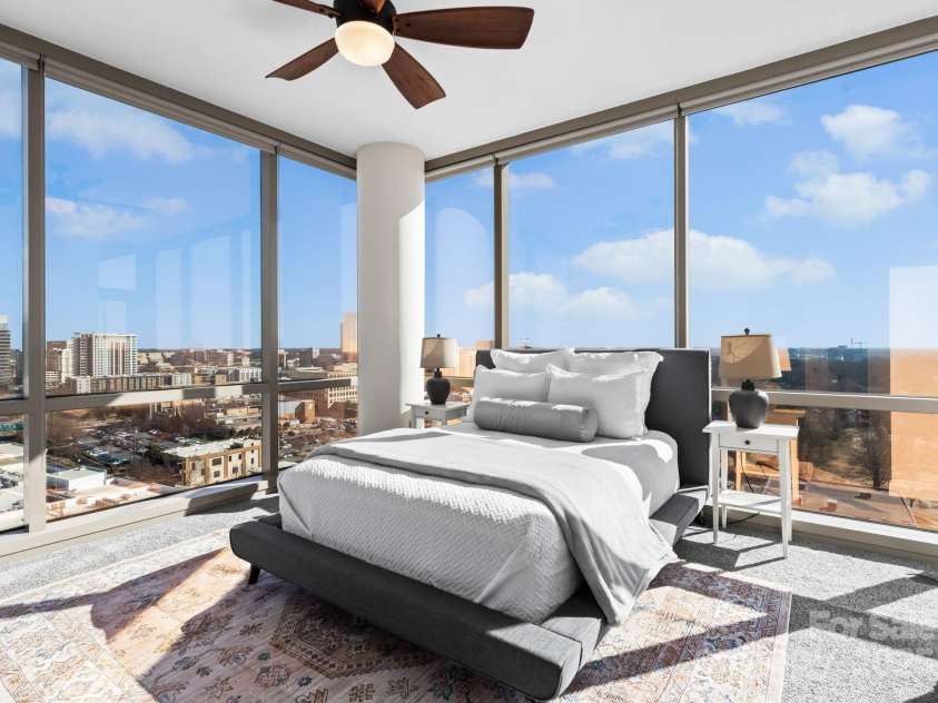 315 Arlington Avenue, Charlotte, NC 28203.  MLS# CAR4334361, YatesRealty ID 1904. Primary bedroom with floor to ceiling windows. 