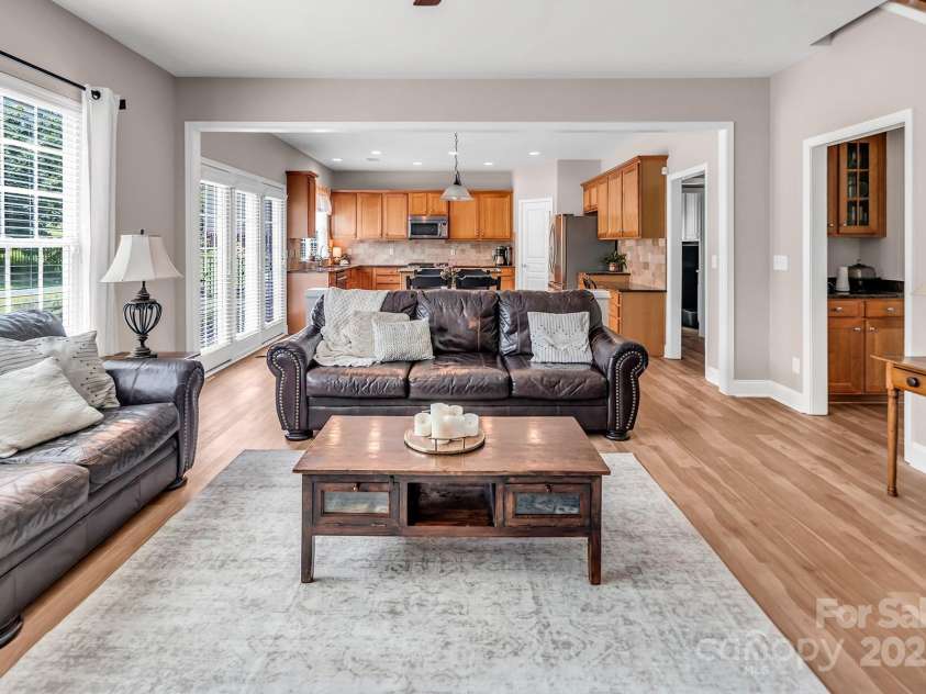 10792 Elsfield Avenue, Concord, NC 28027.  MLS# CAR4261572, YatesRealty ID 19040. Family room and kitchen with butler's pantry to the dining room