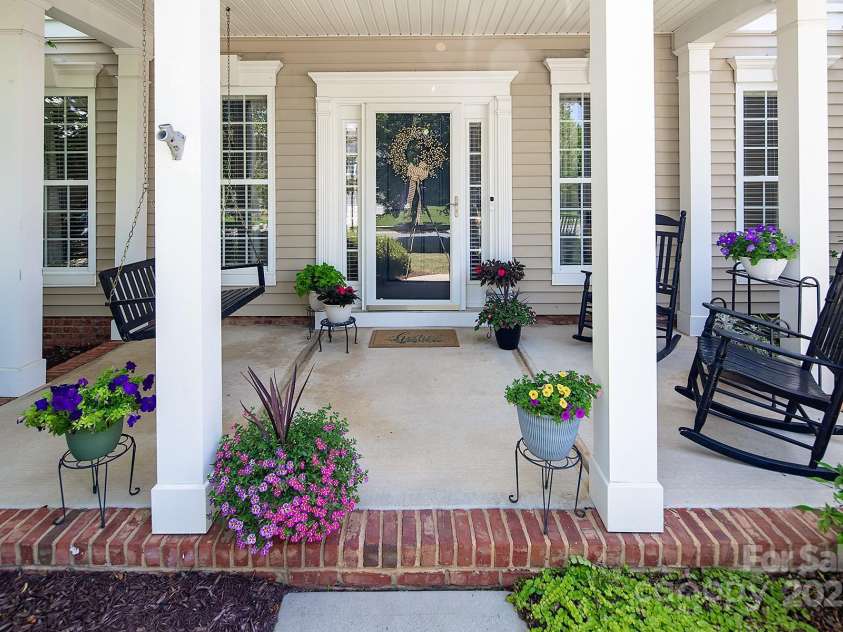 10792 Elsfield Avenue, Concord, NC 28027.  MLS# CAR4261572, YatesRealty ID 19040. Large covered front porch and storm door