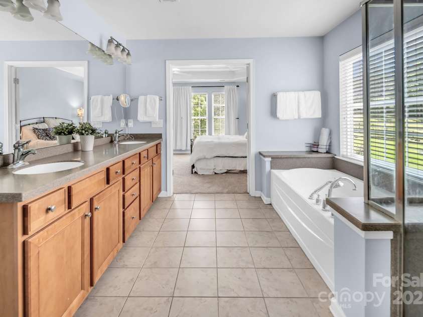 10792 Elsfield Avenue, Concord, NC 28027.  MLS# CAR4261572, YatesRealty ID 19040. Tall double vanity with Corian countertops