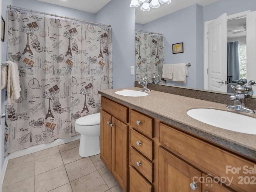 10792 Elsfield Avenue, Concord, NC 28027.  MLS# CAR4261572, YatesRealty ID 19040. Upstairs bathroom- tall double vanity and Corian countertops