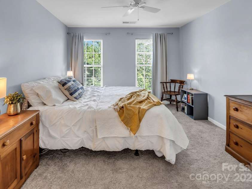 10792 Elsfield Avenue, Concord, NC 28027.  MLS# CAR4261572, YatesRealty ID 19040. Upstairs bedroom #3 with a king-sized bed