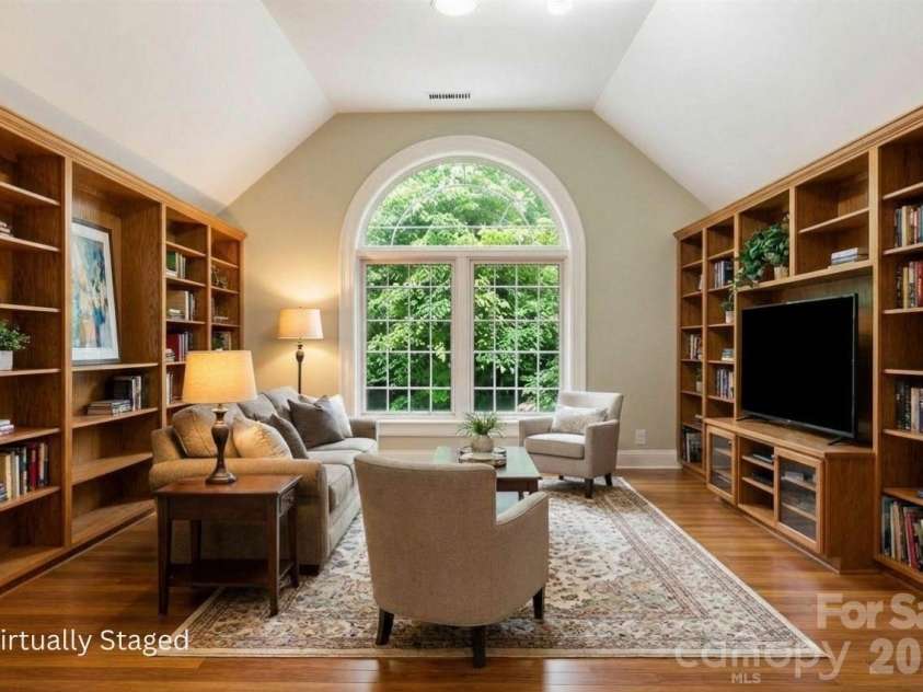 301 Gateway Drive, Hendersonville, NC 28739.  MLS# CAR4373962, YatesRealty ID 19050. Flex room that is virtually staged as a library. Current owner used it as an art studio, so there is plenty of light!