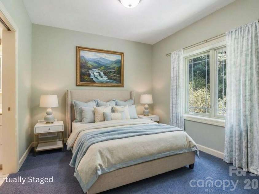301 Gateway Drive, Hendersonville, NC 28739.  MLS# CAR4373962, YatesRealty ID 19050. Lower level flex room that can also be used as a bedroom. Virtually staged.