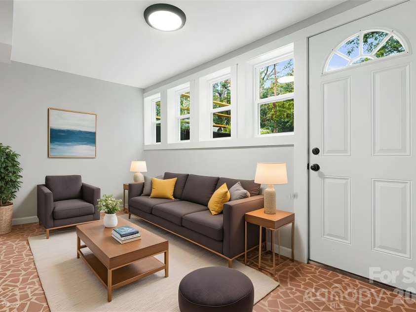 95 Grassy View Road, Candler, NC 28715.  MLS# CAR4283278, YatesRealty ID 19056. A fun rec room and a pullout sofa for guests!